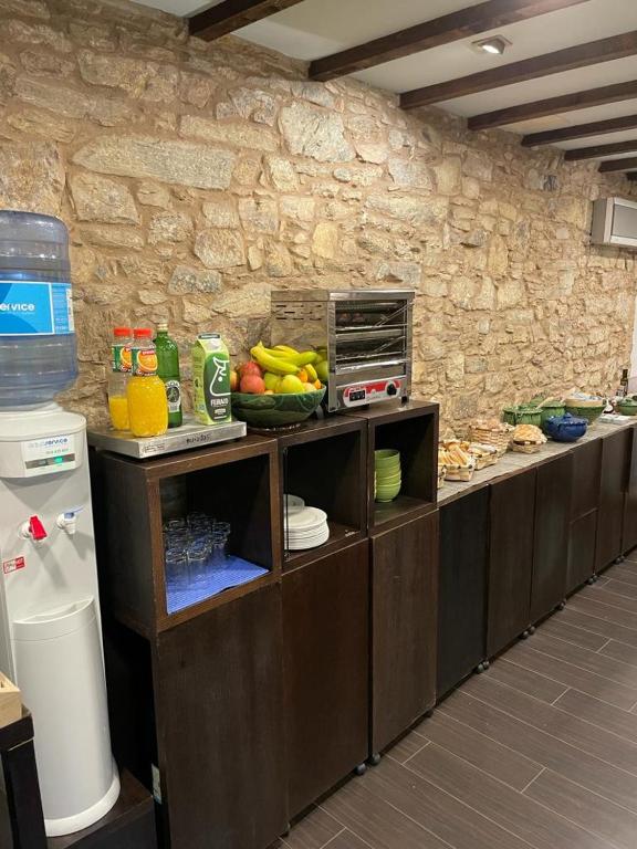 Una cocina o zona de cocina en Hotel A Tafona do Peregrino