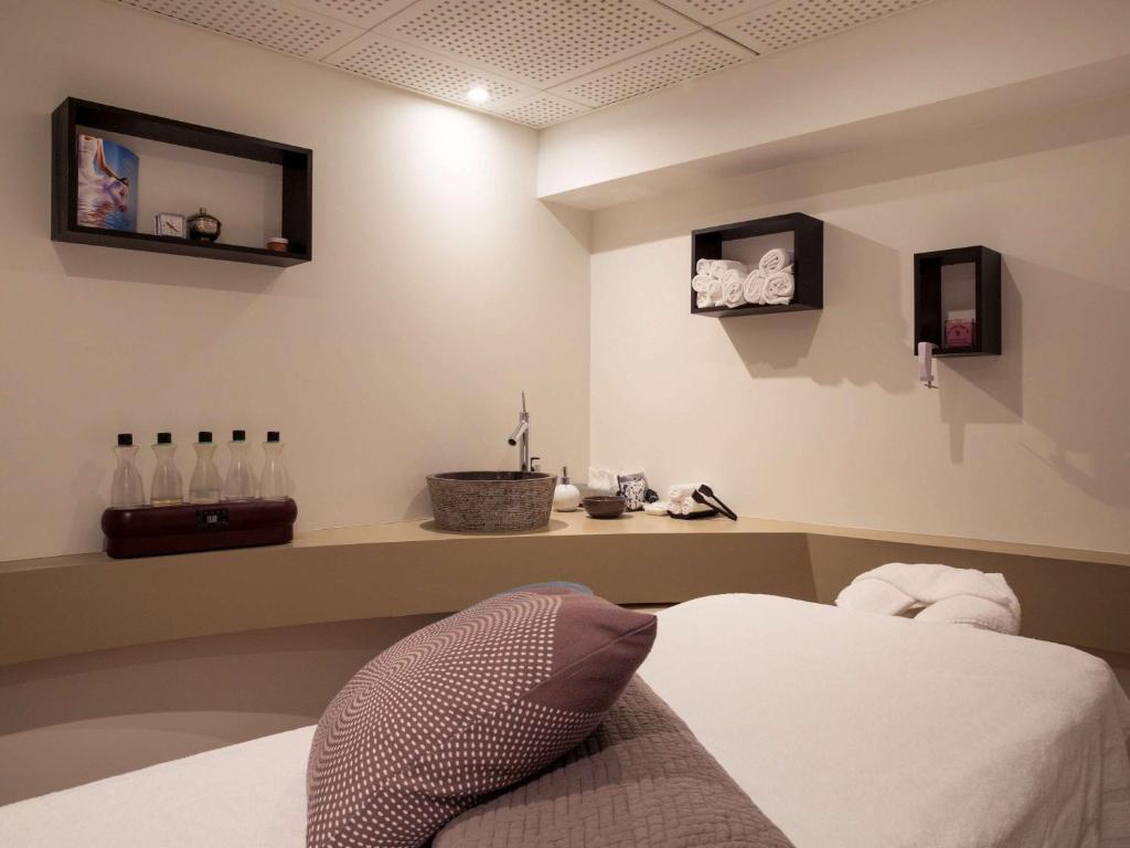 Postel nebo postele na pokoji v ubytování Novotel Genève Centre