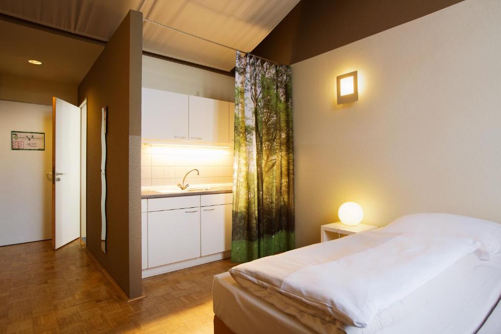 Postel nebo postele na pokoji v ubytování Gästeresidenz PelikanViertel