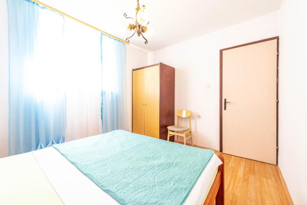 Postel nebo postele na pokoji v ubytování Apartments Danijela