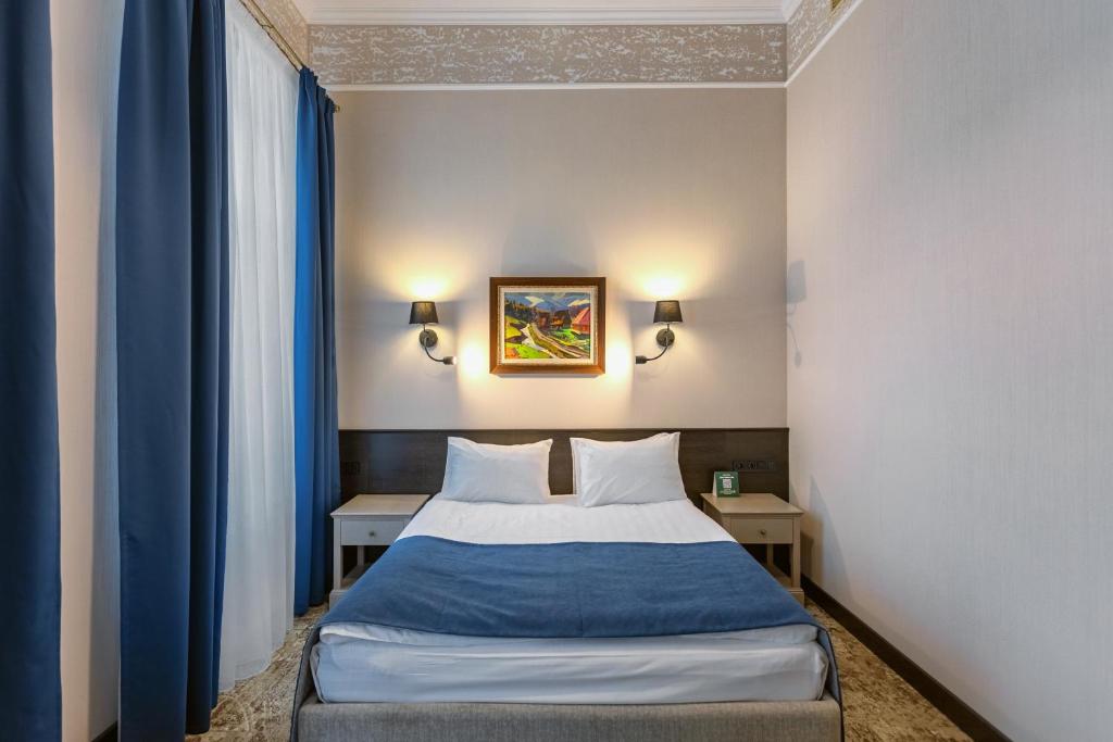 Postel nebo postele na pokoji v ubytování Ayvazovsky Hotel