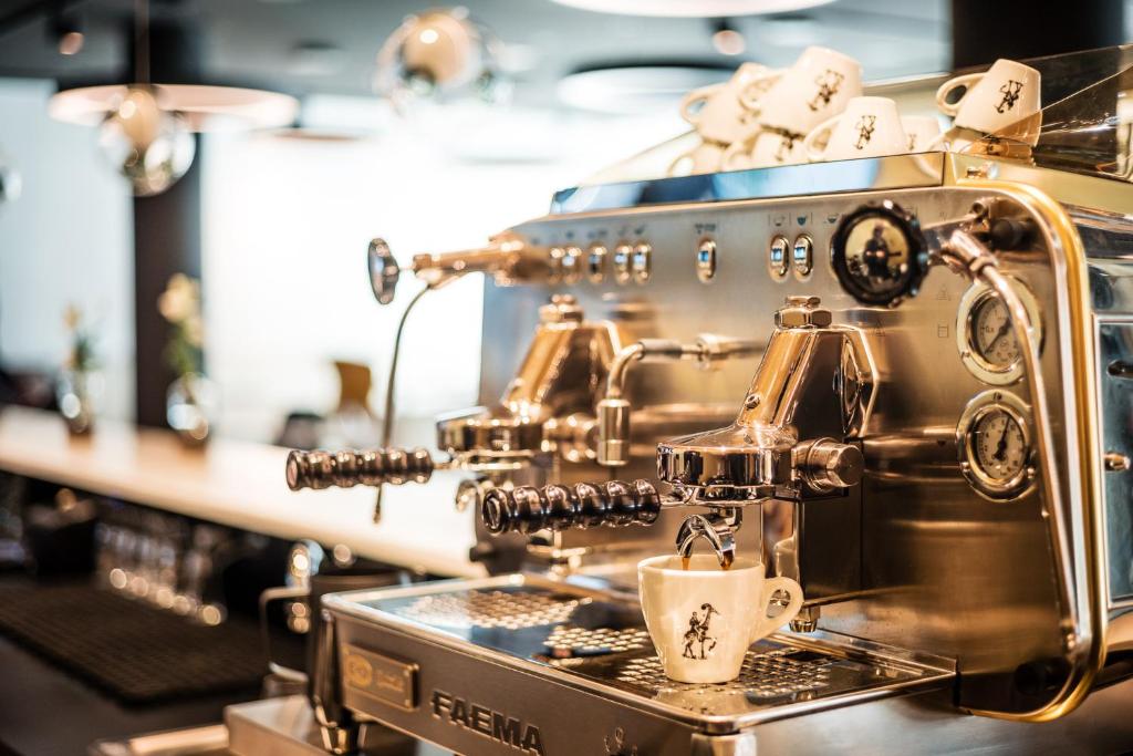 a coffee machine on a counter in a coffee shop at MOOONS Vienna in Vienna