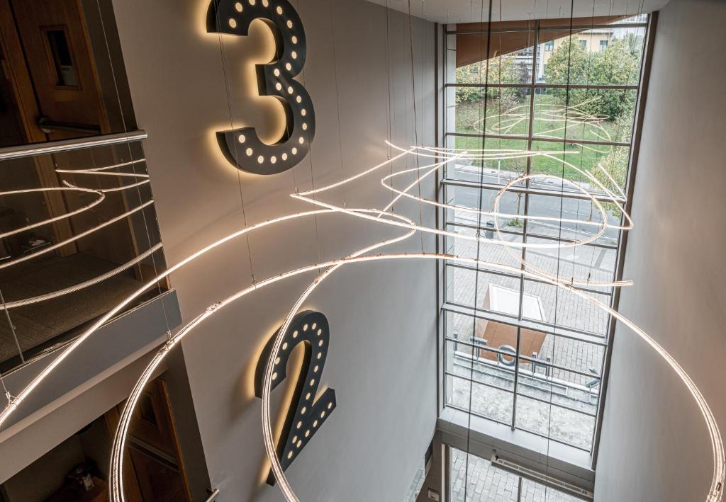 a spiral staircase with a number on the wall at Hotel Antik San Sebastián in Donostia-San Sebastián