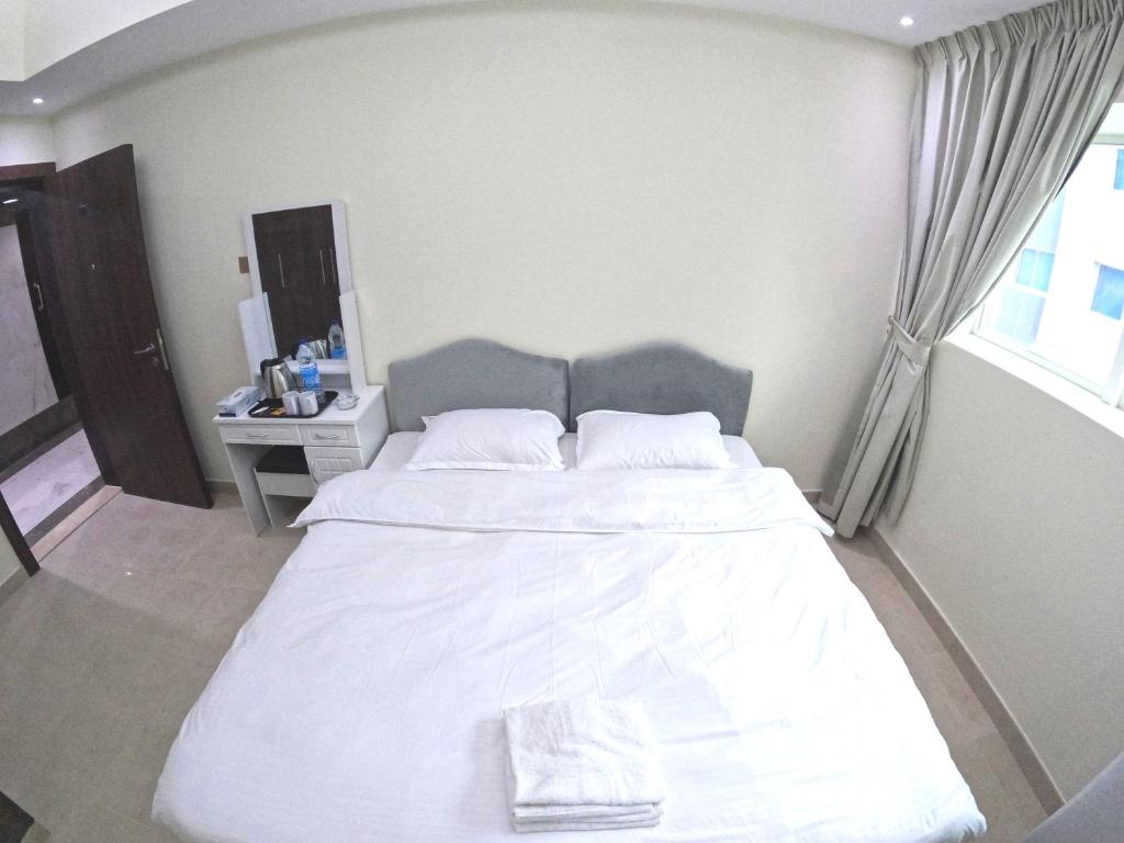 Letto o letti in una camera di Barsha Star Residence - Home Stay