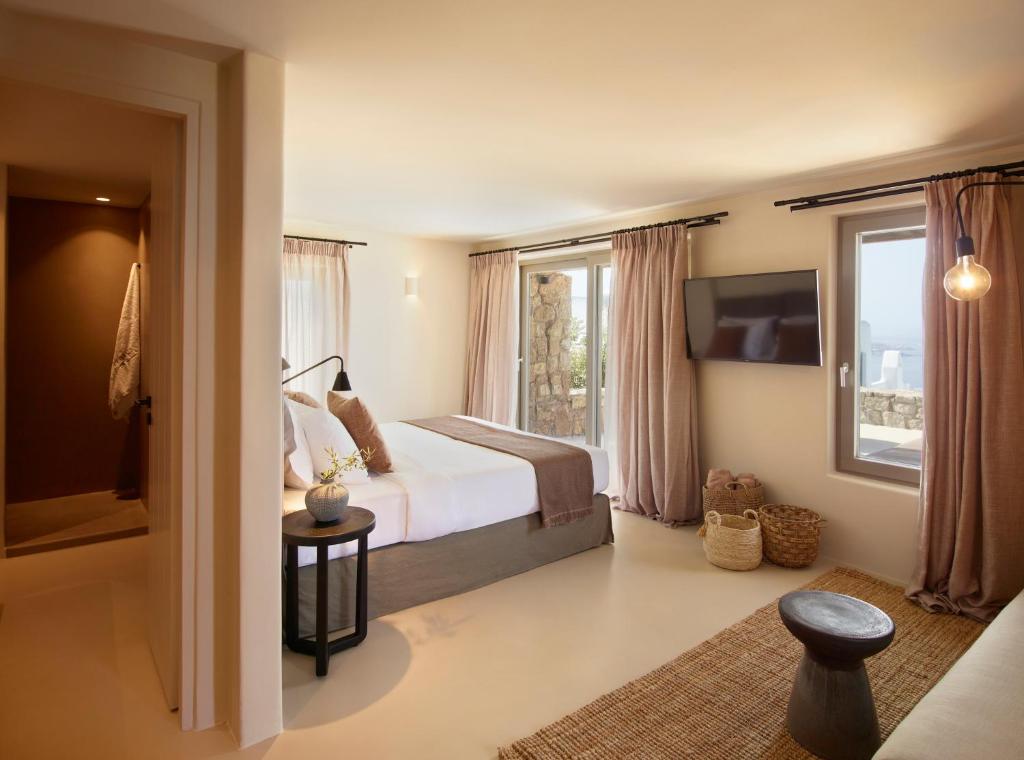 Postel nebo postele na pokoji v ubytování Collini Hotel Mykonos