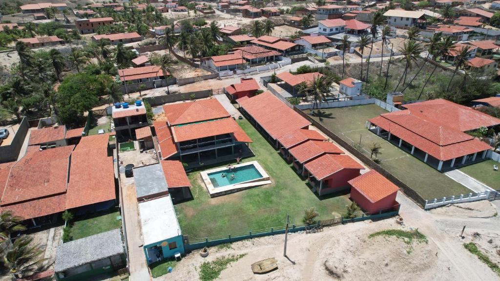 an overhead view of a house with red roofs at Takito Kite House, Praia da Baleia, Itapipoca CE in Franco