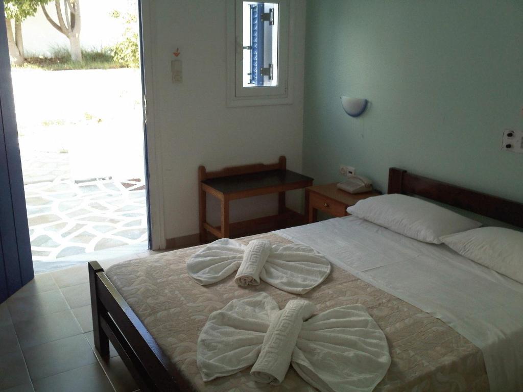 Postel nebo postele na pokoji v ubytování Summer Shades Hotel - ex Arkoulis