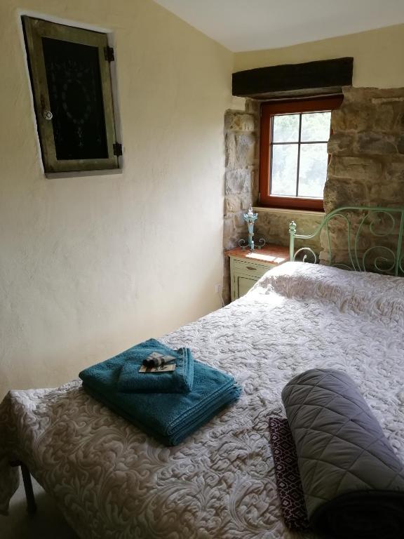 Postel nebo postele na pokoji v ubytování CASA LUCERTOLA