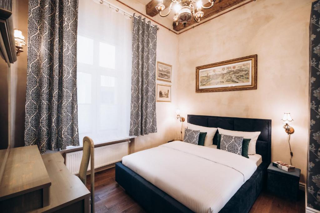 Posteľ alebo postele v izbe v ubytovaní Native Apartments Dunajewskiego 2