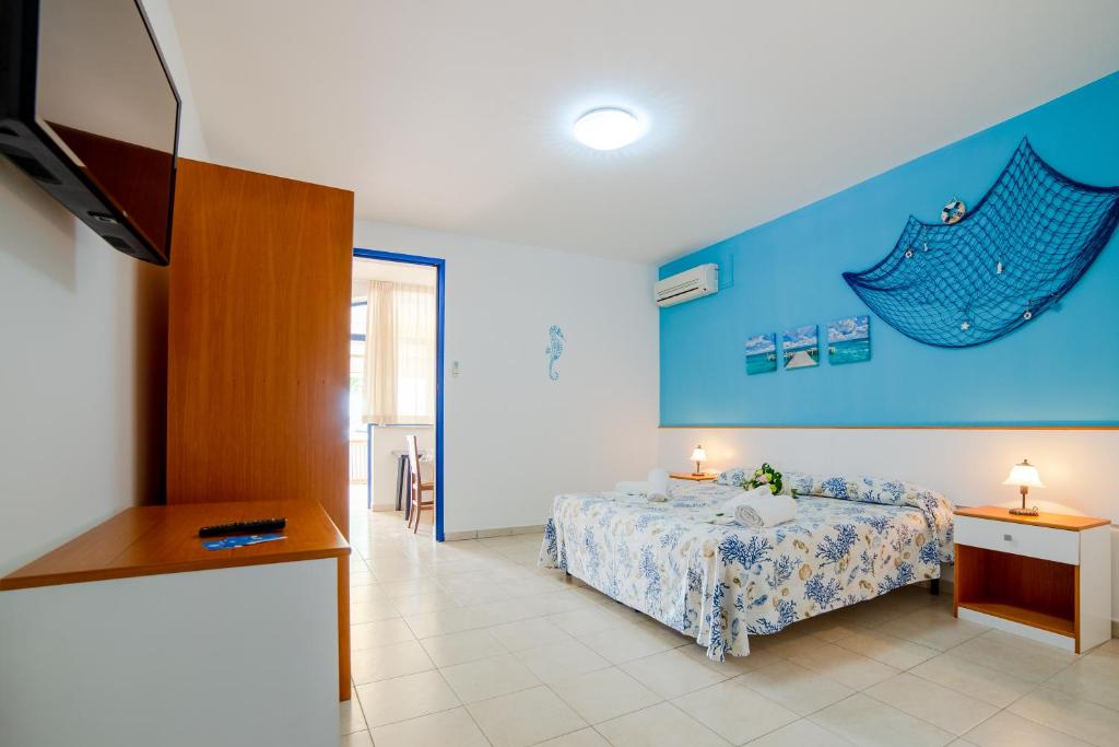 A bed or beds in a room at Scialabà Residence Salento