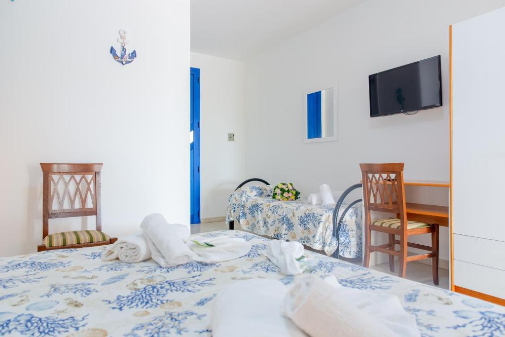 A bed or beds in a room at Scialabà Residence Salento