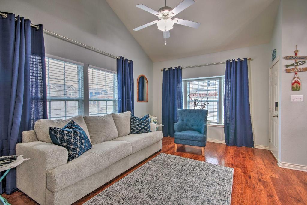 a living room with a couch and a ceiling fan at 1 Block to Boat Ramp Monkey Island Home in Afton