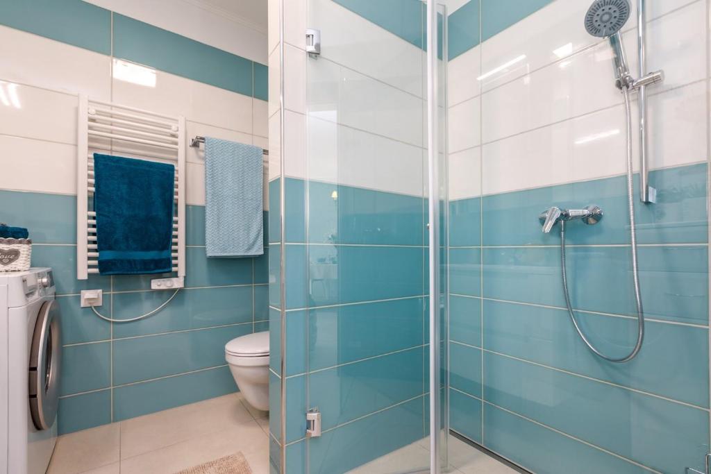 A bathroom at VeronikApartman - brand new & cozy - with underground garage