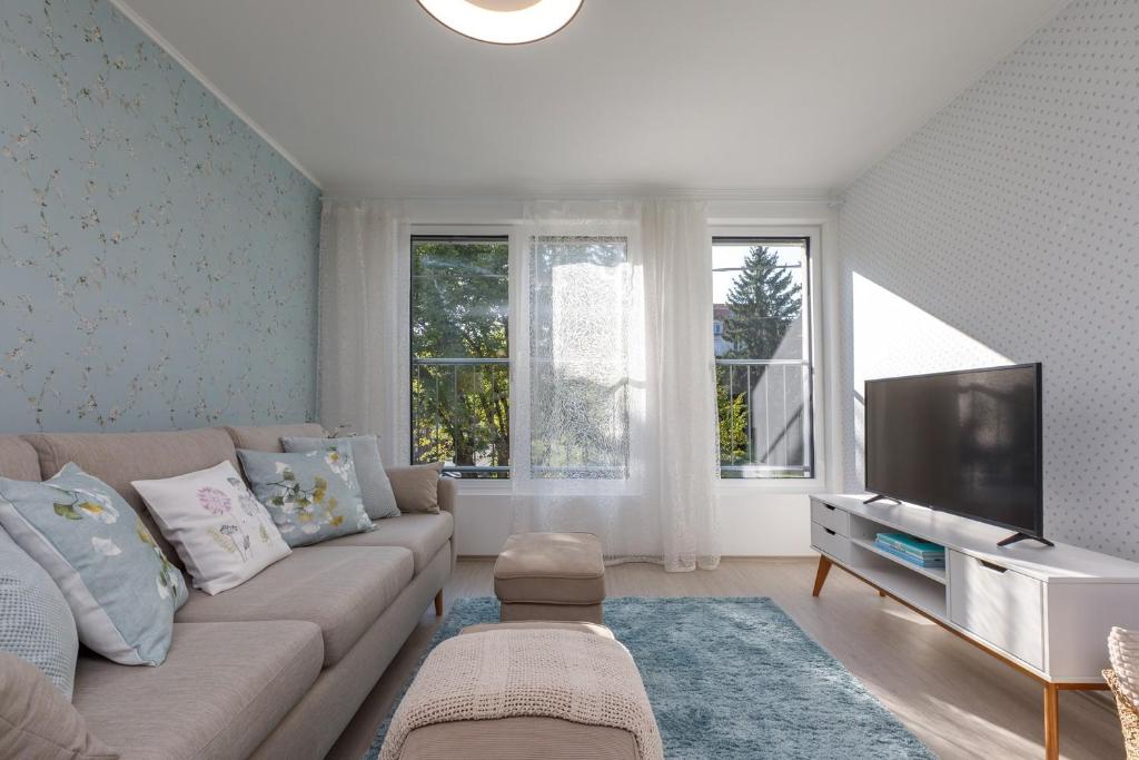 A television and/or entertainment centre at VeronikApartman - brand new & cozy - with underground garage