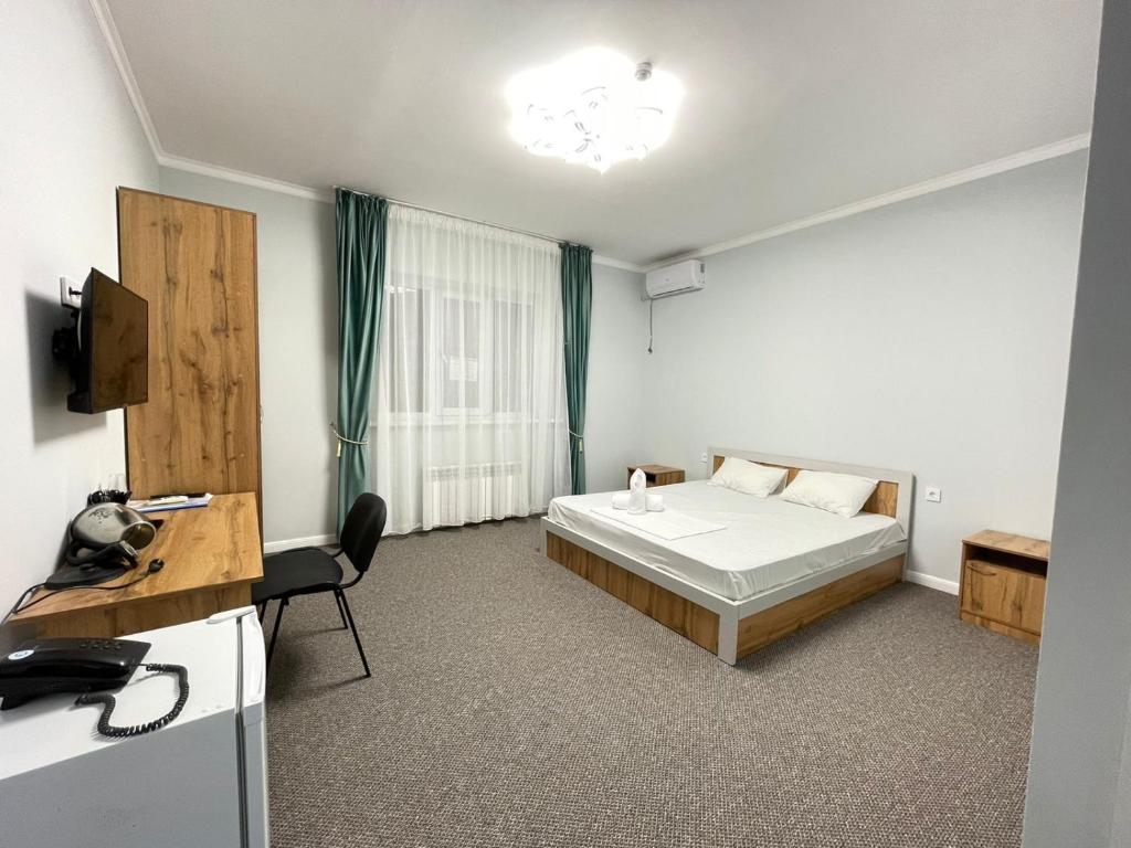 Postel nebo postele na pokoji v ubytování Мунайшы