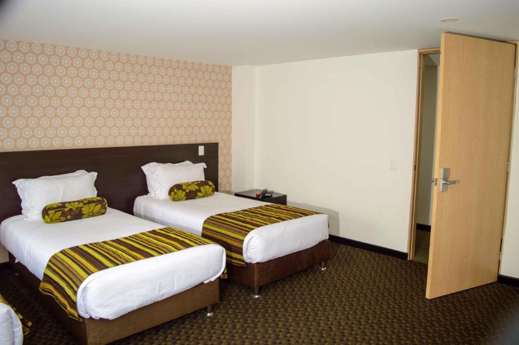 Postel nebo postele na pokoji v ubytování Castellana 95 Bogota By Hoteles Confort 80