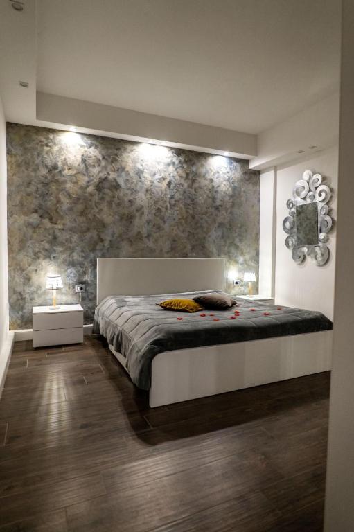 Łóżko lub łóżka w pokoju w obiekcie Resort Villa La Perla Sul Mare