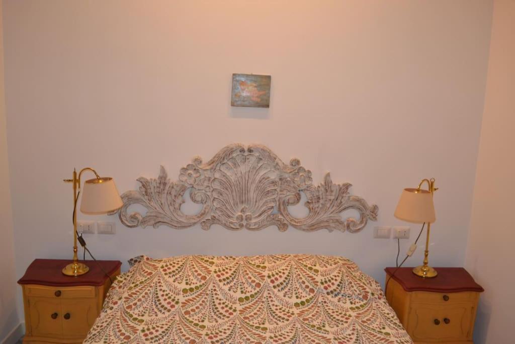 Posteľ alebo postele v izbe v ubytovaní Casa Luciano al San Carlo