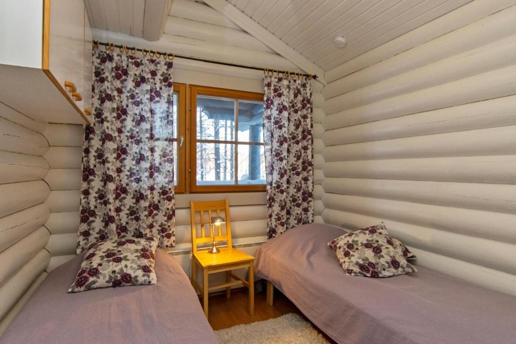 Postel nebo postele na pokoji v ubytování Hallan Akka Apartments