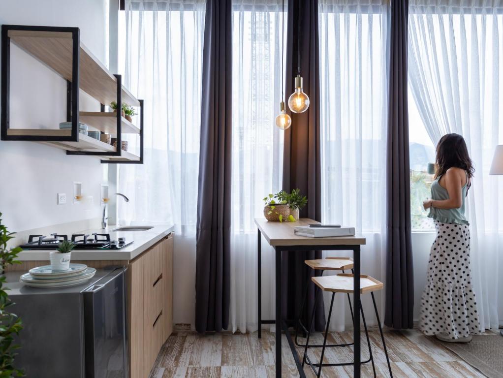 Kuchyň nebo kuchyňský kout v ubytování Lexum by Bernalo Hotels