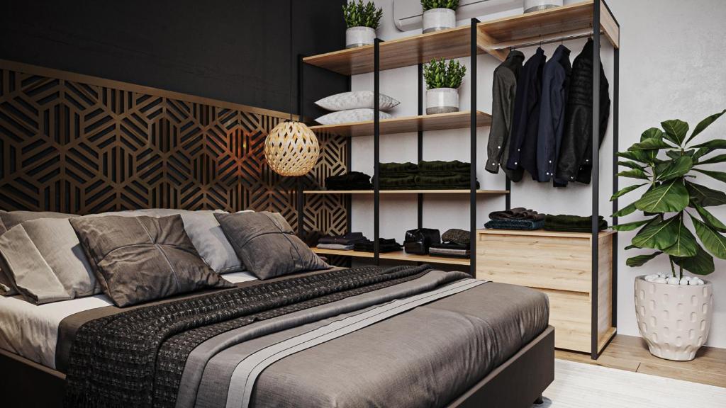 - une chambre avec un lit et des étagères avec des vêtements dans l'établissement Hotel Lexum Estadio, à Medellín