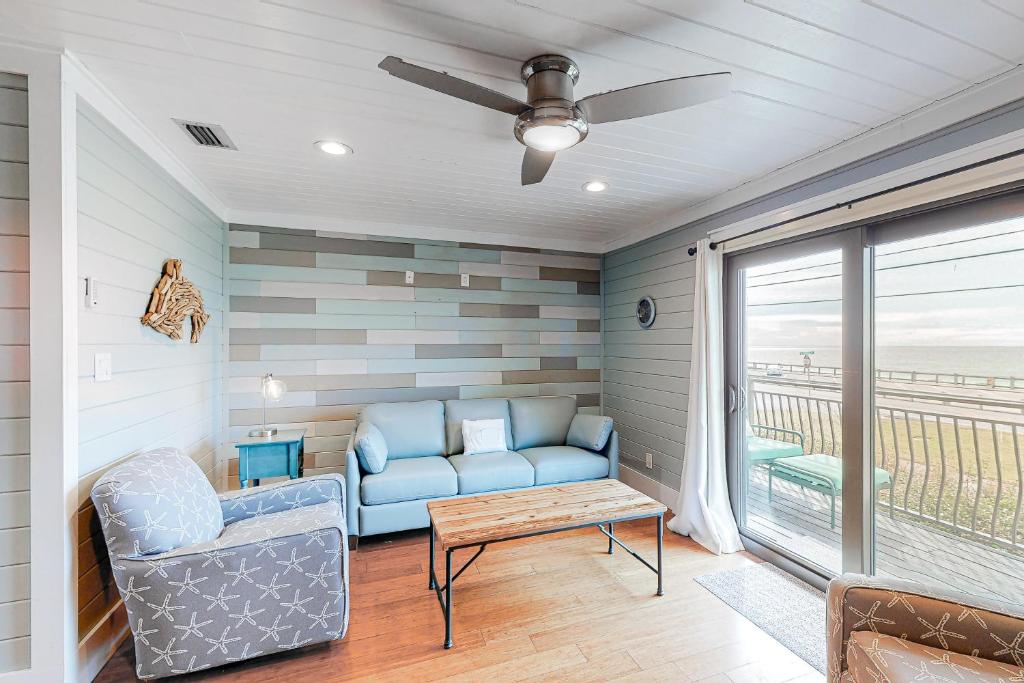 a living room with a couch and a table at Costa Vista Townhomes in Destin