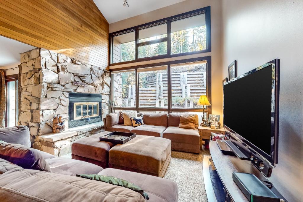 a living room with a large flat screen tv at Stonebridge Valley View in Park City