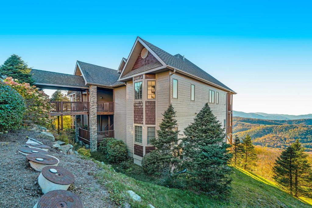 a house with a view of the mountains at Overlook at the Reserve in Sugar Mountain
