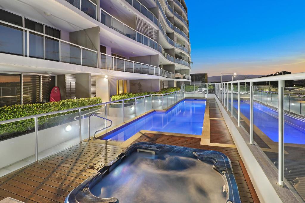a hot tub on the roof of a building at Pandanus Mooloolaba in Mooloolaba