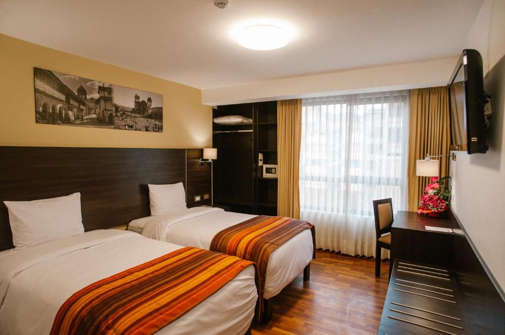 Postel nebo postele na pokoji v ubytování Royal Inn Cusco Hotel
