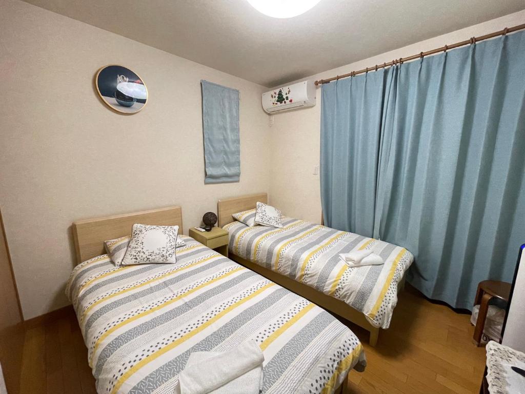 Postel nebo postele na pokoji v ubytování MIKOTO HOUSE