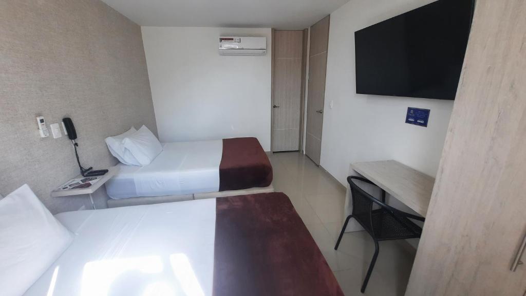 TV a/nebo společenská místnost v ubytování Bayit Tov Circunvalar Hotel