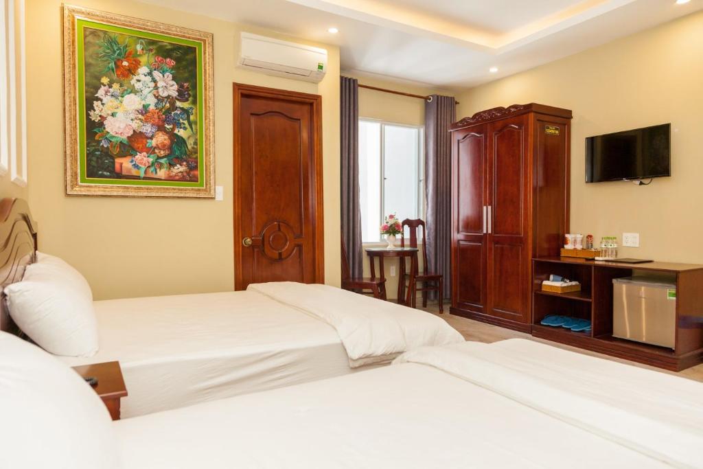 Postel nebo postele na pokoji v ubytování Sea Memory Hotel