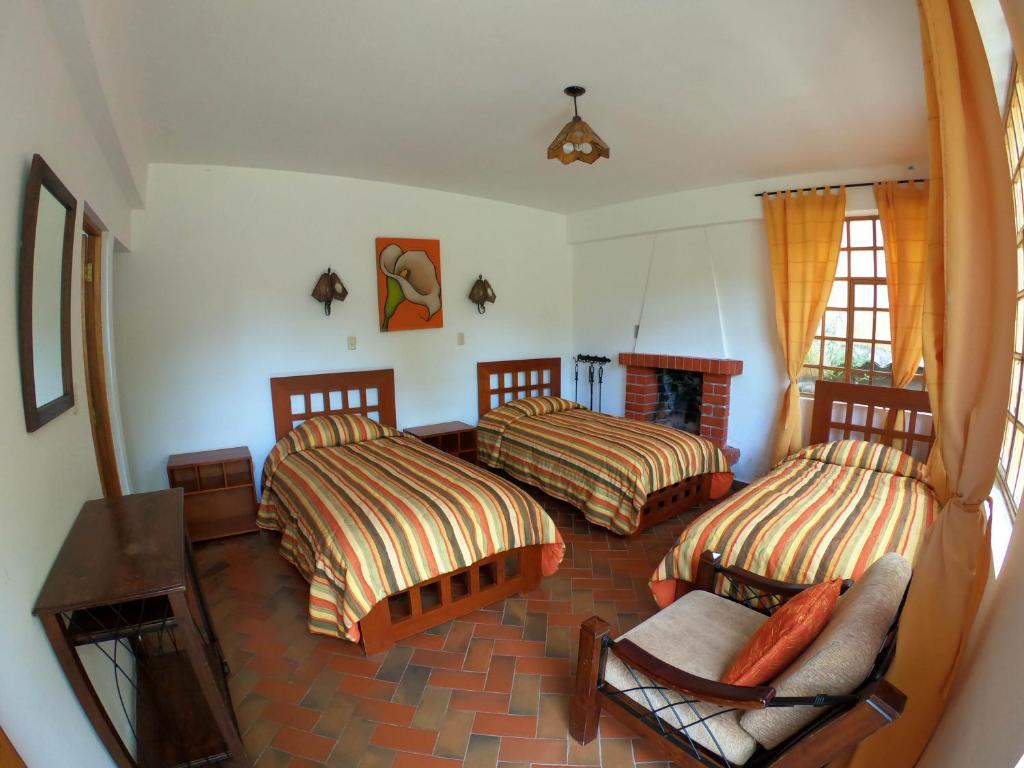 Postel nebo postele na pokoji v ubytování Amaru Valle Hotel