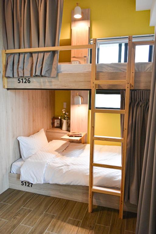 Postel nebo postele na pokoji v ubytování Golden W Hotel