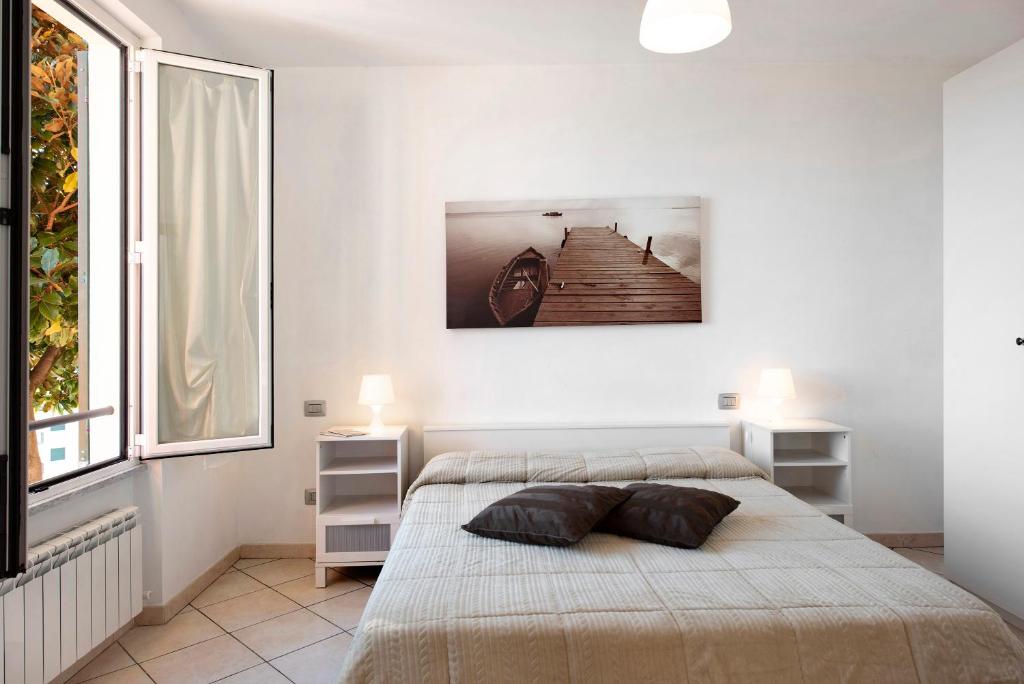 Łóżko lub łóżka w pokoju w obiekcie Trilocale in villa vista mare Apt 3