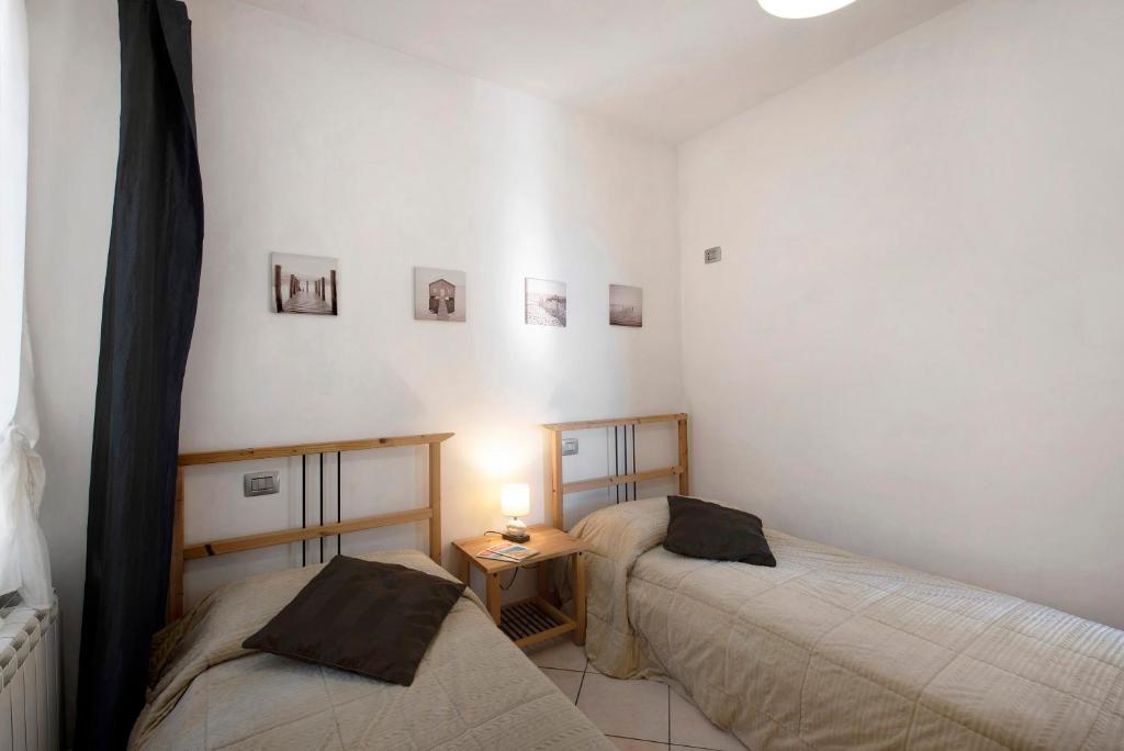 Łóżko lub łóżka w pokoju w obiekcie Trilocale in villa vista mare Apt 3