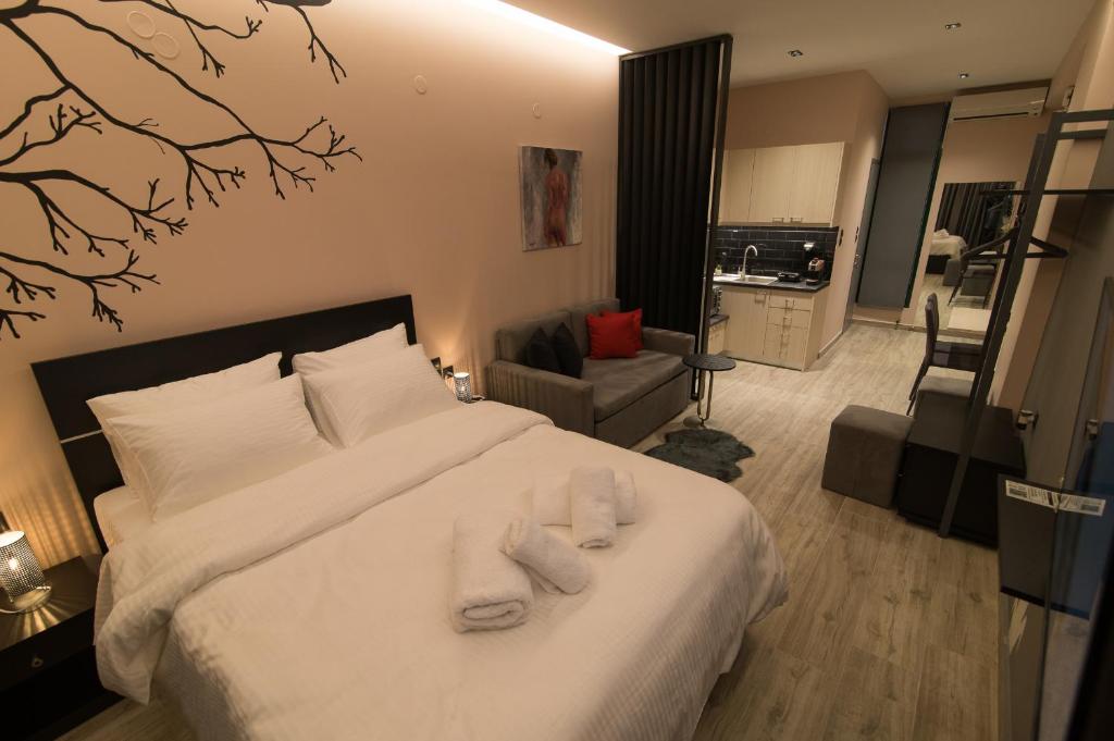 Łóżko lub łóżka w pokoju w obiekcie Elegant Studio
