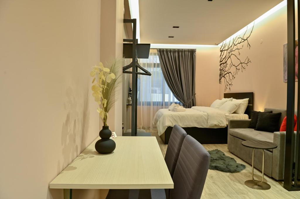 Łóżko lub łóżka w pokoju w obiekcie Elegant Studio