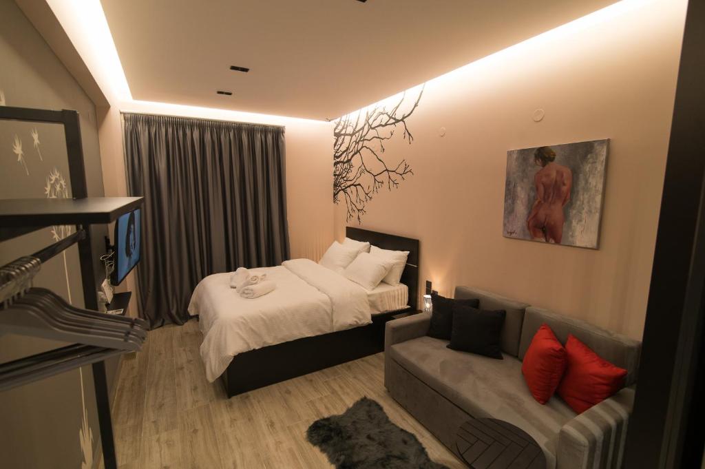 Łóżko lub łóżka w pokoju w obiekcie Elegant Studio