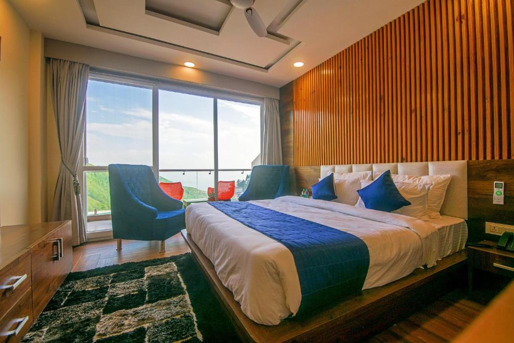 Ένα ή περισσότερα κρεβάτια σε δωμάτιο στο Tripli Hotels Shivaay