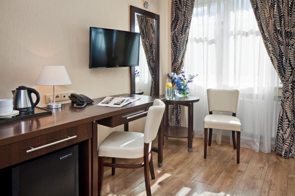 TV a/nebo společenská místnost v ubytování Hotel Bonum Old Town