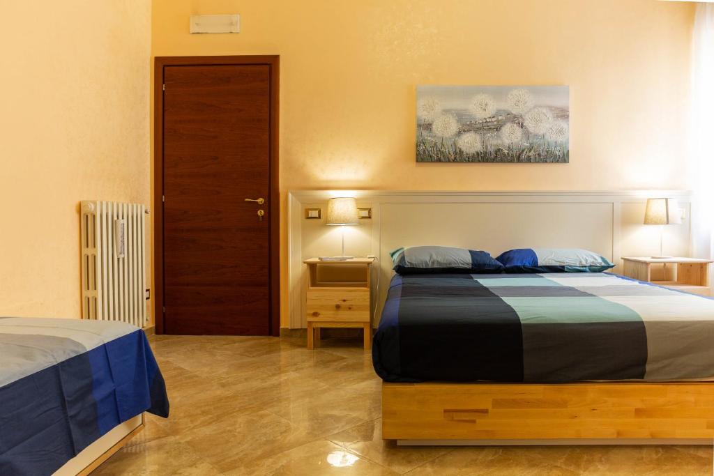 En eller flere senger på et rom på Via Nonantola- twobedrooms apartment