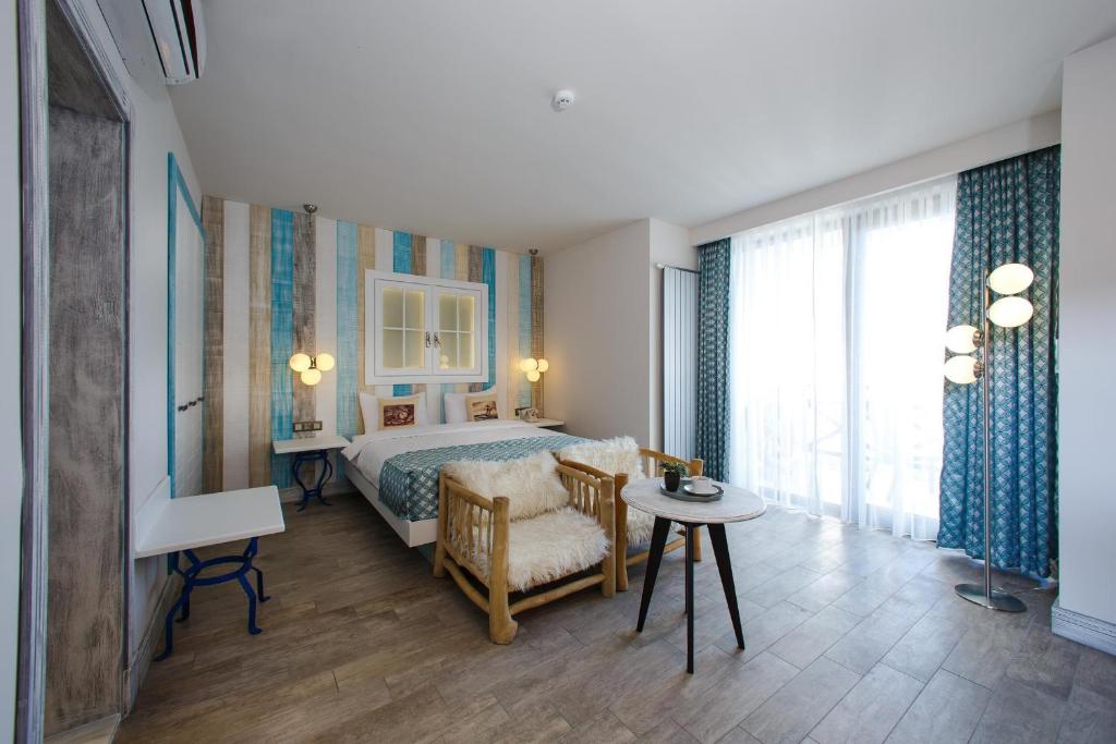 Postel nebo postele na pokoji v ubytování Assos Barbarossa Special Class Hotel