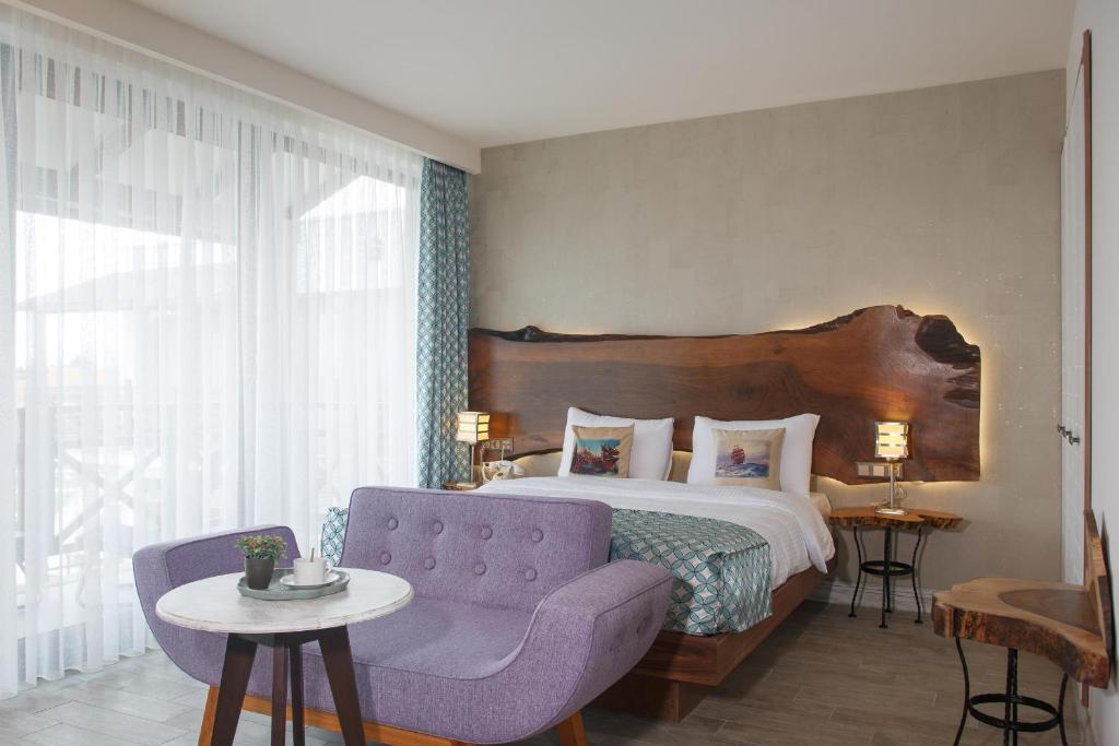 Postel nebo postele na pokoji v ubytování Assos Barbarossa Special Class Hotel
