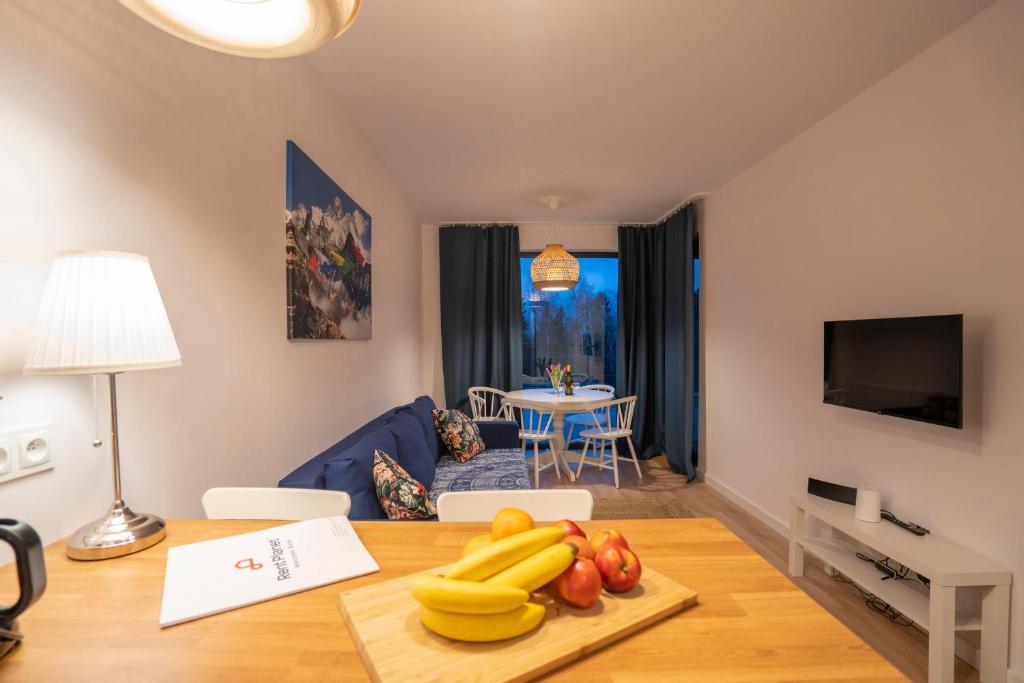 Televízia a/alebo spoločenská miestnosť v ubytovaní RentPlanet - Apartamenty Schroniskowa