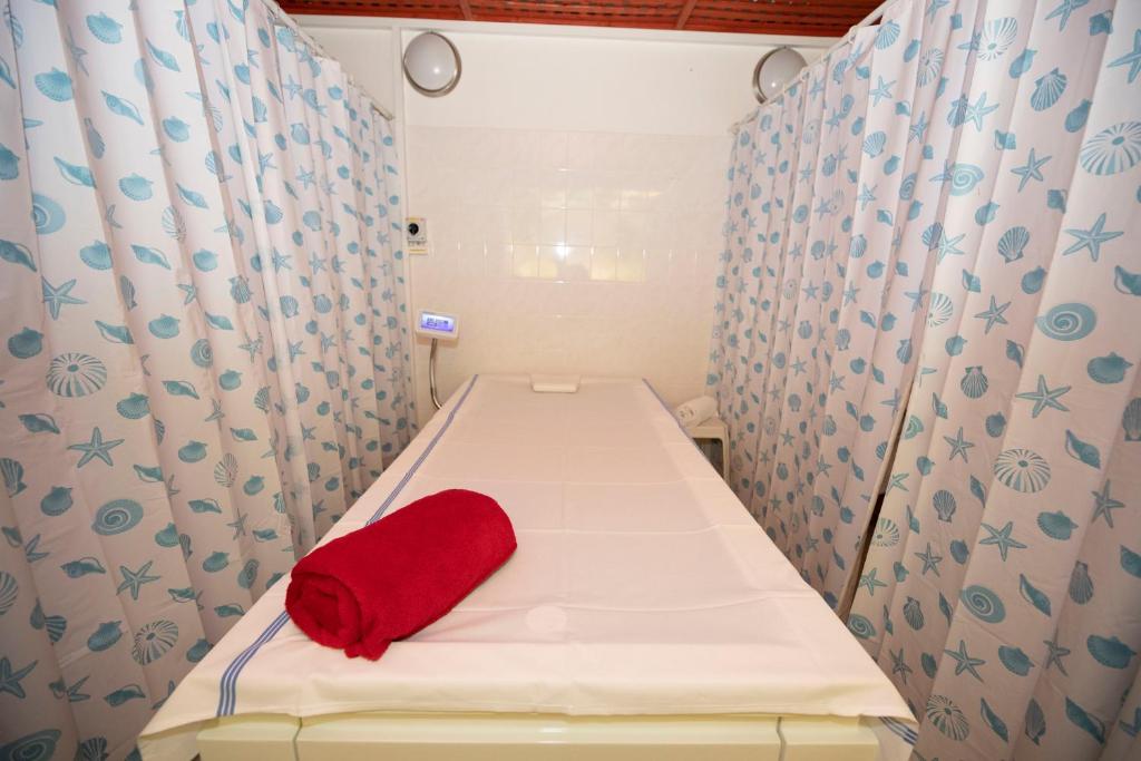 Postel nebo postele na pokoji v ubytování Hotel Paris