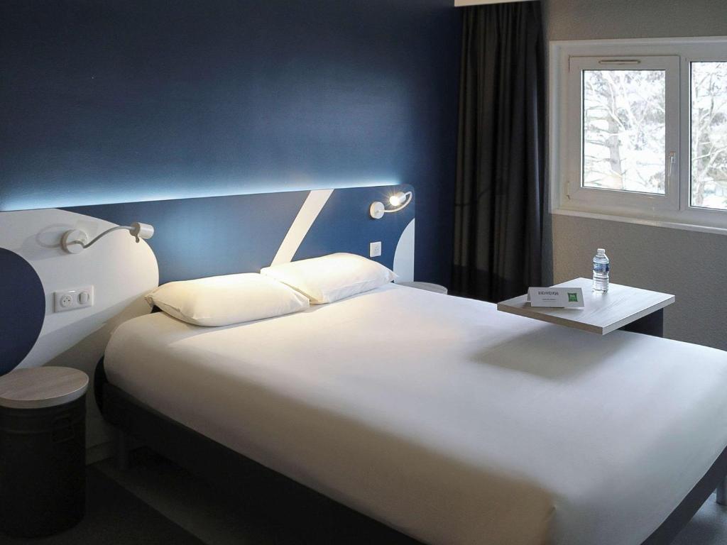 Postel nebo postele na pokoji v ubytování ibis Styles Beauvais