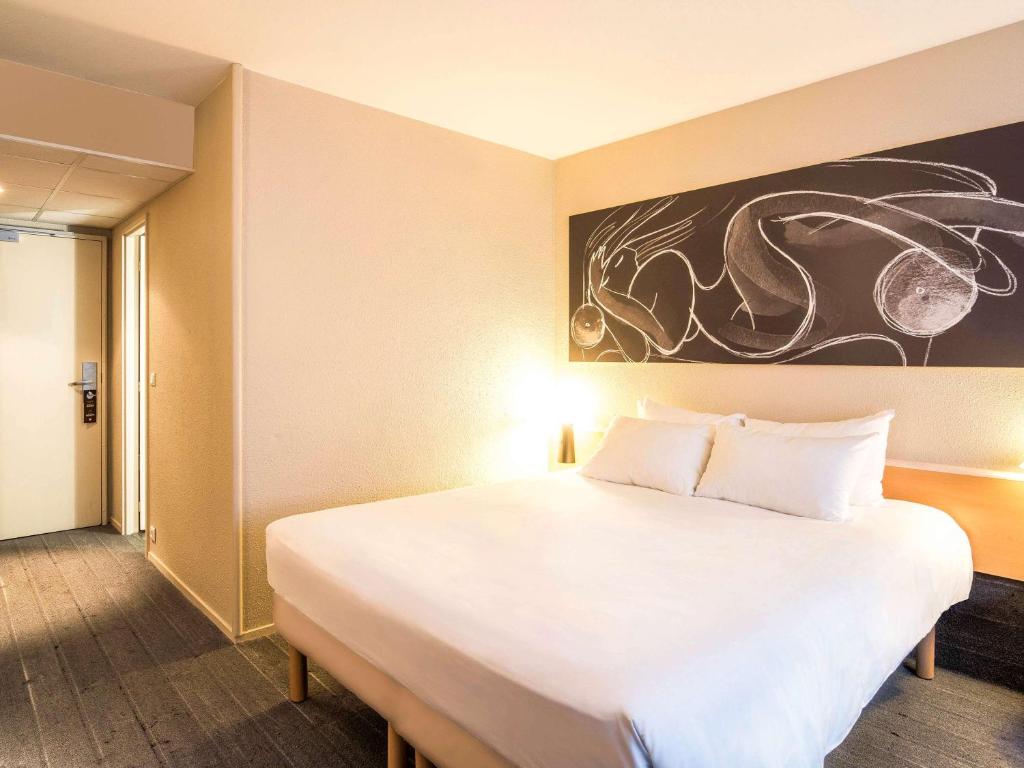 Postel nebo postele na pokoji v ubytování ibis Metz Nord