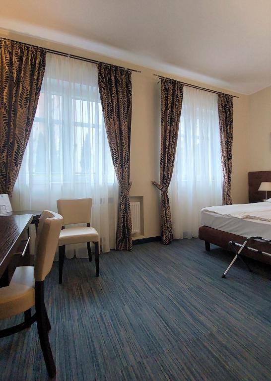 Postel nebo postele na pokoji v ubytování Hotel Bonum Old Town